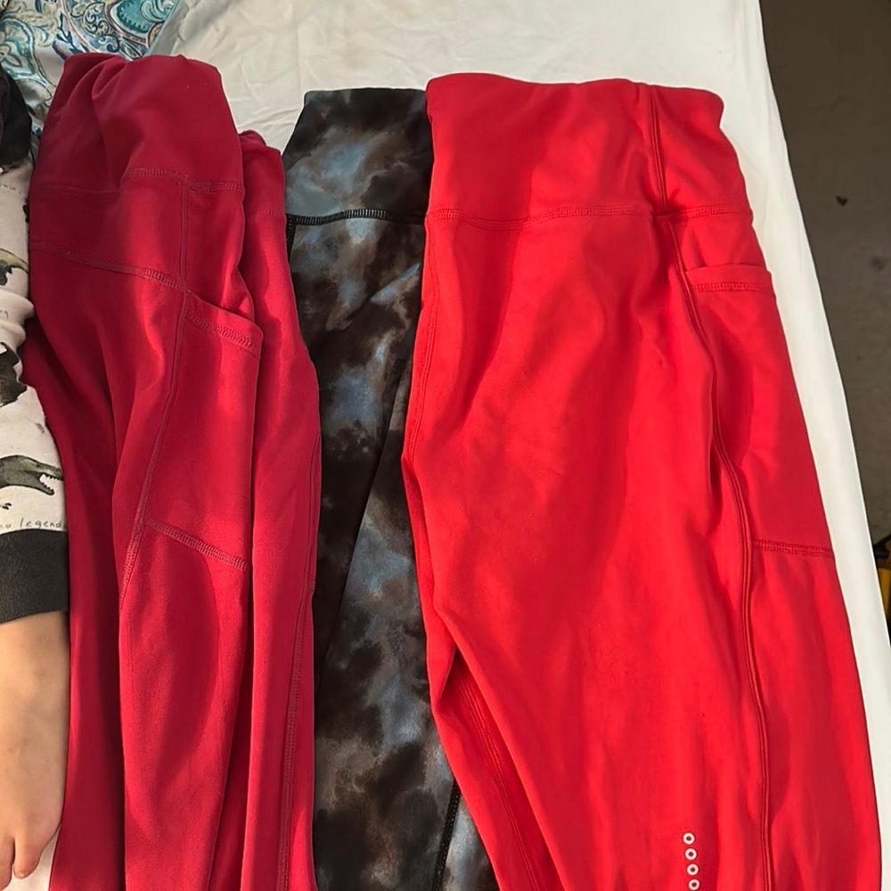Bundle 3 pair of leggings 2 red and 1 blue, grey and black.